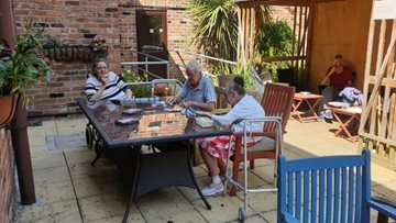 Enjoying ice-cream, sunshine and one-to-one sessions at Worsley Lodge